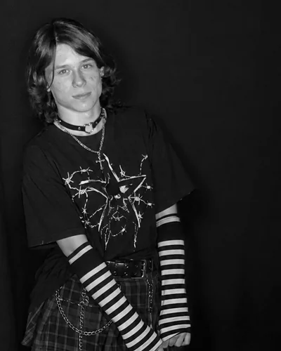 Artem Chaika, photographed against a black backdrop